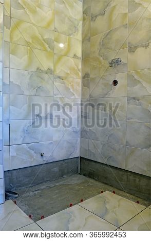 Fastening Of A Ceramic Tile To Walls And A Floor In A Shower