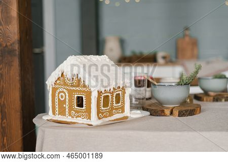 Gingerbread House On The Christmas Table With Copy Space
