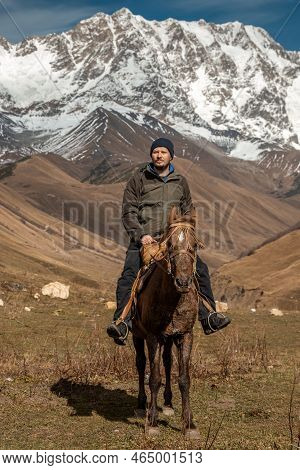 Horseback Riding The Snowy Mountains Of Svanetia Region Of Georgia.