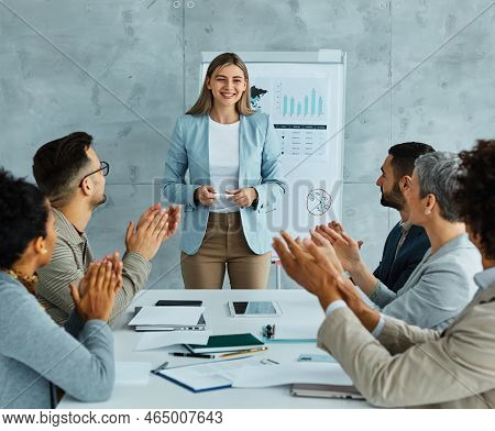 Group Of Young Business People Having A Meeting Or Presentation And Seminar With Whiteboard In The O