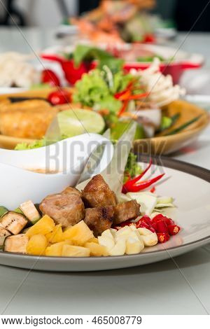 Close Up Of Namnueng With Sliced Banana Pine Apple Chilli And Dipped Sauce With Row Of Various Vietn