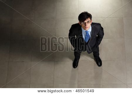 Image of young businessman in glasses. Top view