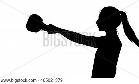 On A White Background, A Shadow, A Black Outline Of A Female Figure Doing Exercises Doing Exercises 