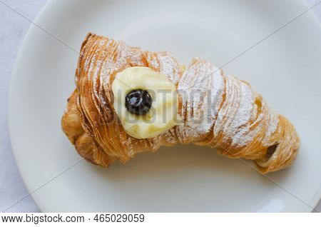 Sfogliatellla Riccia (also Called Lobster Tail In The Us) On A White Plate. The Concept Of Tradition