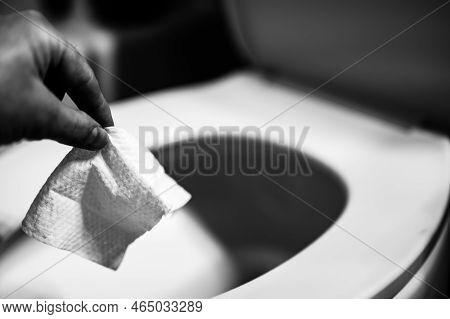 Disposable Wipes Being Flushed Down A Toilet Where They Can Cause Clogging And Problems With Wastewa