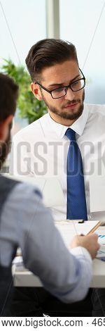 Portrait Of Coworkers Men Working At Financial Papers, Solve And Discuss Problems. Businessmen Analy