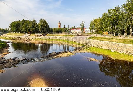 View Of The Old Water Tower And The Embankment Of The Polist River In Staraya Russa, Russia