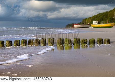 Breakwater On The Beach Of The Baltic Sea Near Rewal.