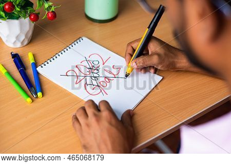 Shoulder Shot Of Young Man Scratching 2022 New Year Goal Teardown Paper - Concept Of Failure, Angry 