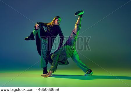 Two Dancers, Stylish Fashionable Dance Couple Dancing Contemporary Dance On Colorful Gradient Blue-g