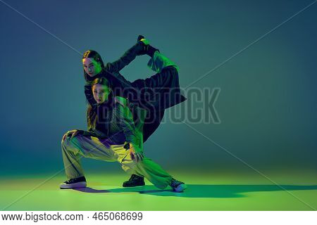 Hope. Two Dancers, Stylish Fashionable Dance Couple Dancing Contemporary Dance On Colorful Gradient 