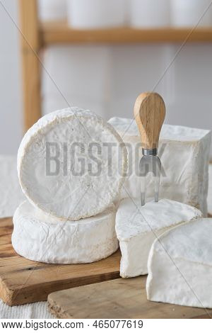 Different Geometric Forms Of Camamber Cheese. Multiform Cheese Camamber Brie Composition. Selective 