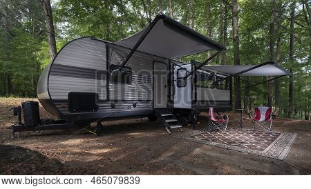 Travel Trailer Set Up With Awnings Out At A Campsite At Jordan Lake North Carolina
