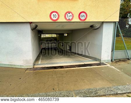 Geneva, Switzerland - September 15 2021: The Entrance Of A Private Underground Parking Under A Build
