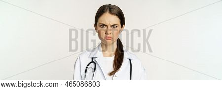 Angry And Upset Young Woman Doctor, Female Healthcare Worker Sulking, Frowning Disappointed, Dislike