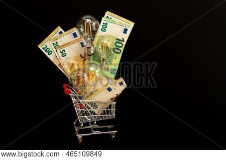 Payment Of Electricity Bills. Price Of Electricity In Europe.light Bulbs Set And Euro Banknotes In A
