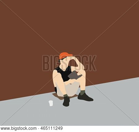 Homeless Man With Orange Hat Reading Book On On The Footpath City Street.