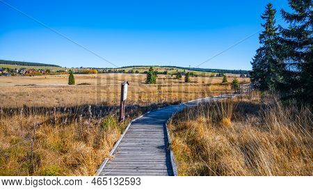 Wooden Path In Bozi Dar Peat Bog Nature Reservation On Sunny Autumn Day. Ore Mountains, Czech: Krusn