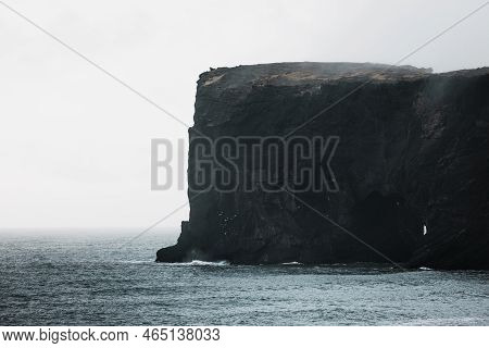 Picturesque Autumn Dyrholaey Cape Cliffs In Fog - Exploring Iceland