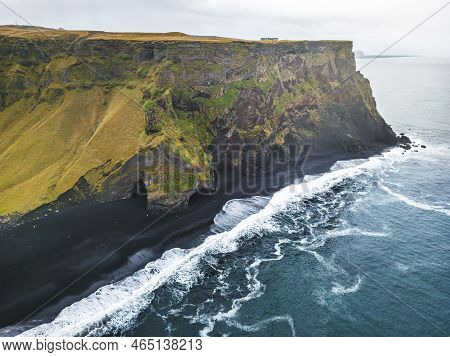 Steep Cliff Coastline Of Reynisfjara Black Beach, Iceland