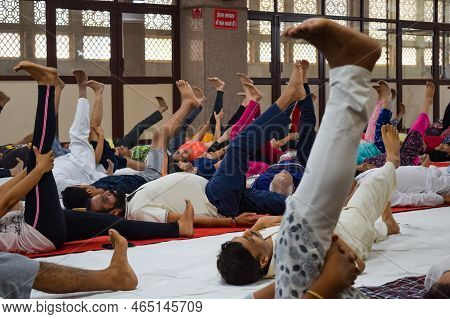 New Delhi, India, June 19 2022 -group Yoga Exercise Session For People Of Different Age Groups In Ba