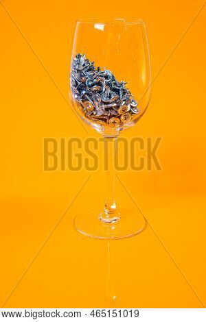 Many Metal Self-tapping Screws Made Of Steel In A Glass, In Bucket Jar. Self-tapping Screw For Metal