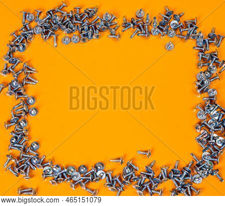 Many Metal Self-tapping Screws Made Of Steel In A Glass, In Bucket Jar. Self-tapping Screw For Metal