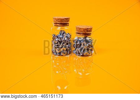 Many Metal Self-tapping Screws Made Of Steel In A Glass, In Bucket Jar. Self-tapping Screw For Metal