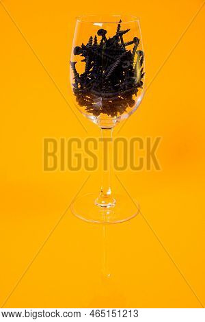 Many Metal Self-tapping Screws Made Of Steel In A Glass, In Bucket Jar. Self-tapping Screw For Metal