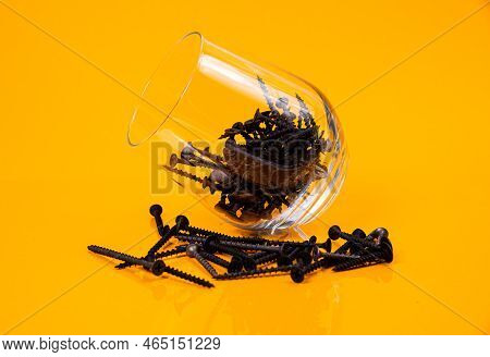Many Metal Self-tapping Screws Made Of Steel In A Glass, In Bucket Jar. Self-tapping Screw For Metal