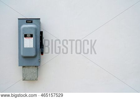 Heavy Duty Safety Switch Interruptor On Concrete Wall Background With Space For Text.