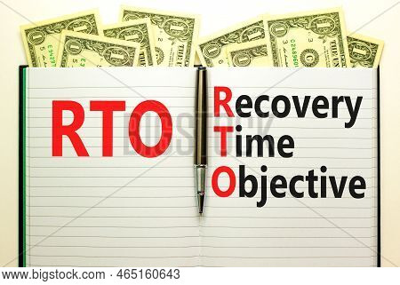 Rto Recovery Time Objective Symbol. Concept Words Rto Recovery Time Objective On White Note On A Bea