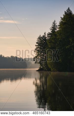 Stone Rocks With Conifers By The Lake In Sweden In Smalland. Wild Nature In Scandinavia. Landscape P