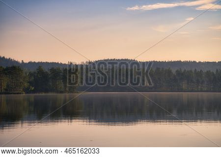 View Over A Lake In Sweden In Smalland With Forest On The Other Shore. Wild Nature In Scandinavia. L