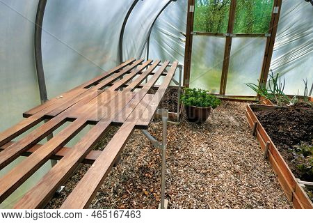 Polytunnel Under Construction - Staging Supports Connected Polytonal Hoops And Vegetable Beds Being 