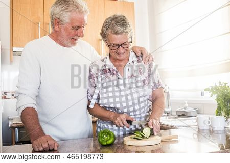 Happy Real Couple In Love Adult Senior People Retired Man And Woman Enjoying The Home Activity In Th