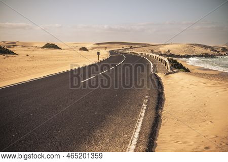 Beautiful Scenic Long Ashalt Road With Desert And Beach Inbackgorund - Concept Of Travel In Tropical