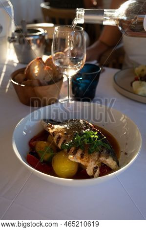 Provence Cuisine, Filet Of Seabass White Fish Served With Potatoes, Tomatoes And .bouillabaisse Jus