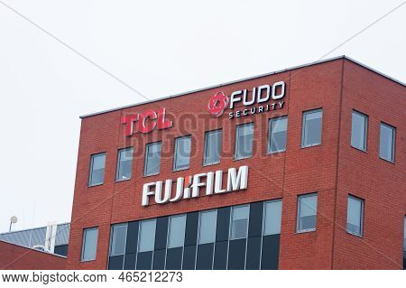Warsaw, Poland - September 10, 2022: Building With Modern Tcl, Fudo Security And Fujifilm Logos