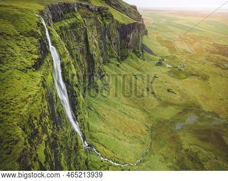 Aerial View Of Green Iceland Landscape With A Waterfall