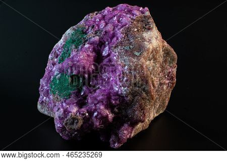 Cobalto calcite with malachite crystal macro on a black surface