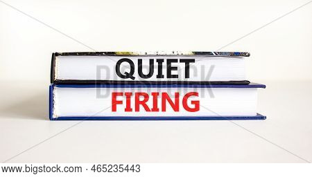 Quiet Firing Symbol. Concept Words Quiet Firing On Books. Beautiful White Table White Background. Bu