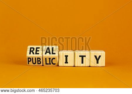 Reality Or Publicity Symbol. Turned Wooden Cubes And Changed The Word Publicity To Reality. Beautifu