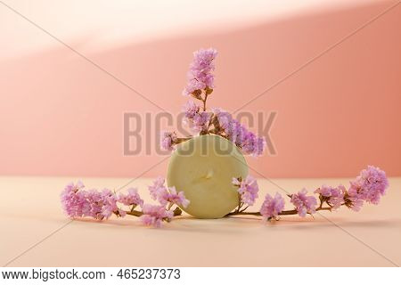 Solid Shampoo In Sunlight With Dried Pink Flowers. Eco Friendly Handmade Bar On Light Pink Colored T