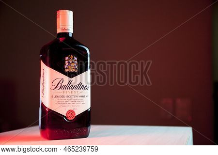 Ballantines Whiskey Bottle With Colorful Lights Background In Bar. Ballantines Concept. Whiskey Conc