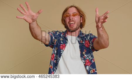Little Bit Crazy. Blonde Joyful Sincere Man Demonstrating Tongue Out, Fooling Around, Making Silly F