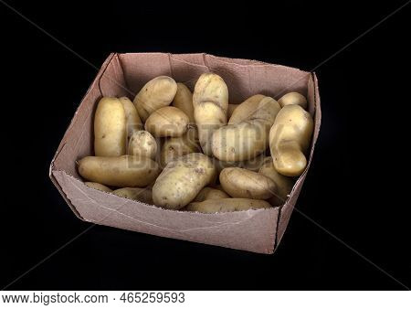 Ratte Potato In Front Of Black Background