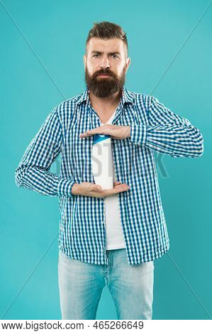 Man Hold Shampoo Bottle. Shampoo And Conditioner You Choose Can Make All Difference In Hair Starting