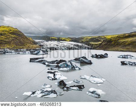 Glacier Lagoon With Crystal Clear Water And Icebergs In Iceland