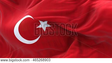 Close-up View Of The Turkey National Flag Waving. The Republic Of Turkey Is A Transcontinental Count